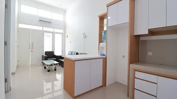 living room dan dapur unit chartar residence